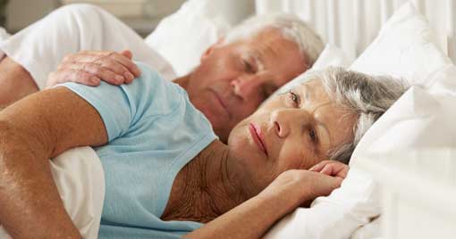 The aged couple sleeping in bed at home in Myers, FL