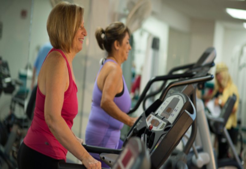 Two womens doing cardio in the gym