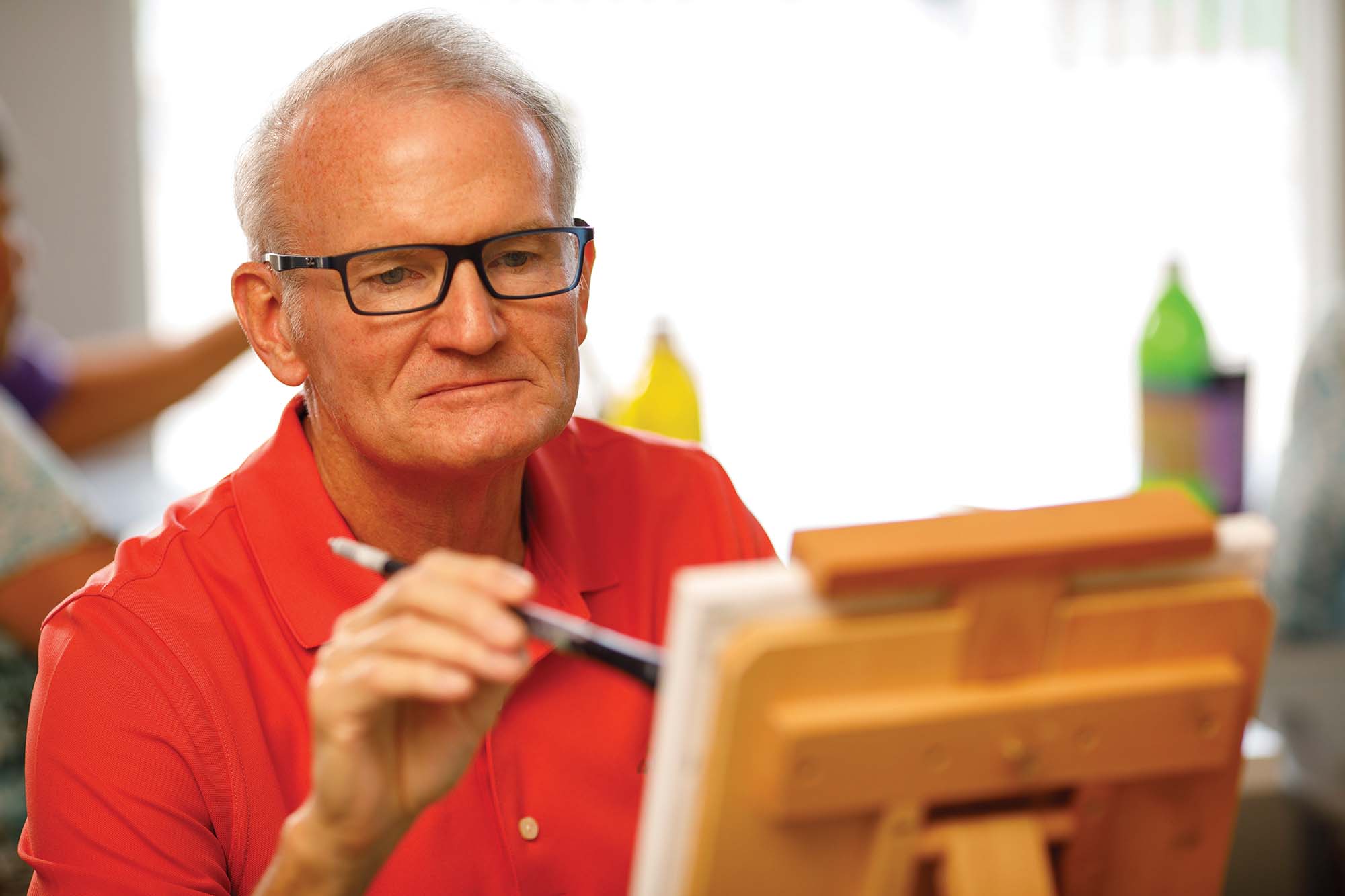 A photo of a resident painting