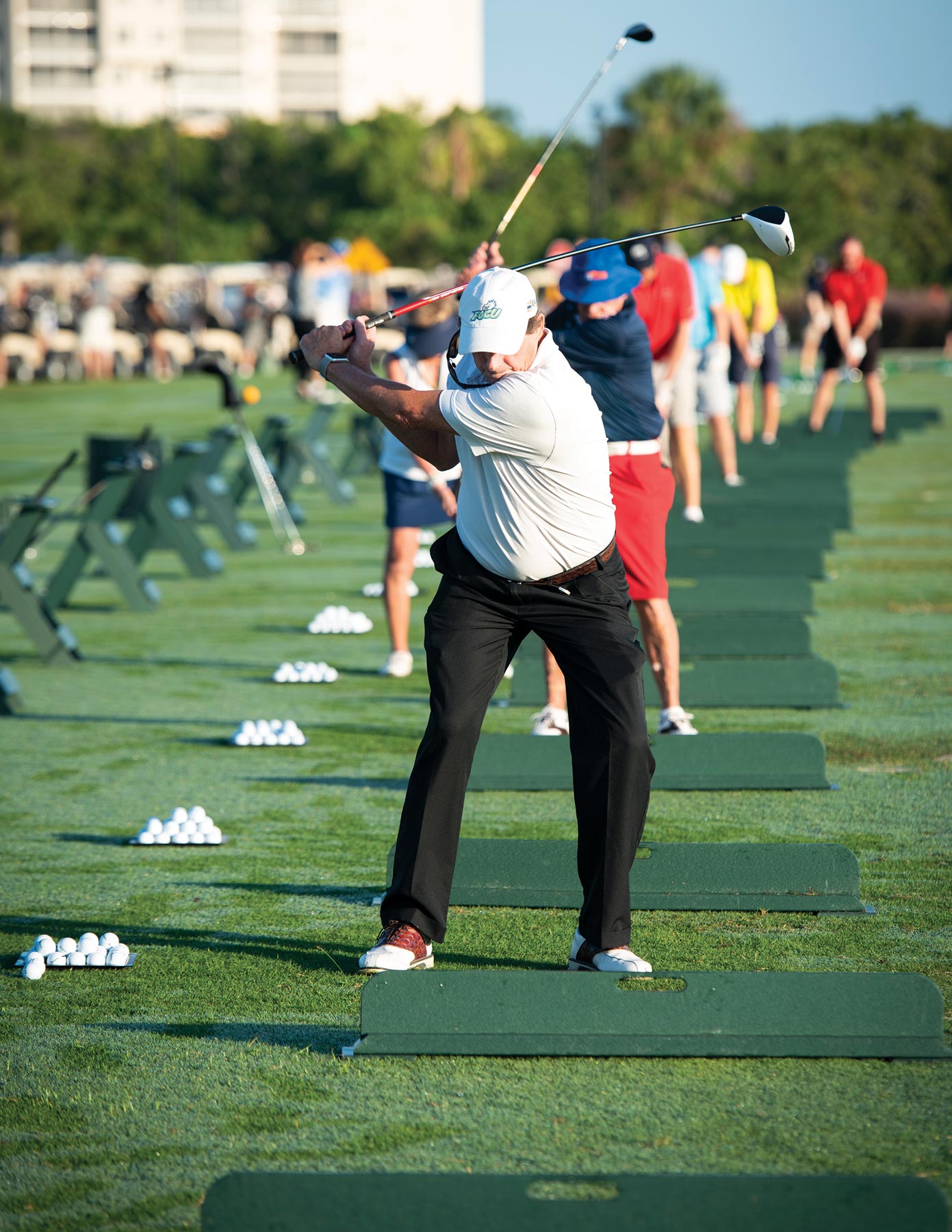 The group of people playing golf in ground at Myers, FL