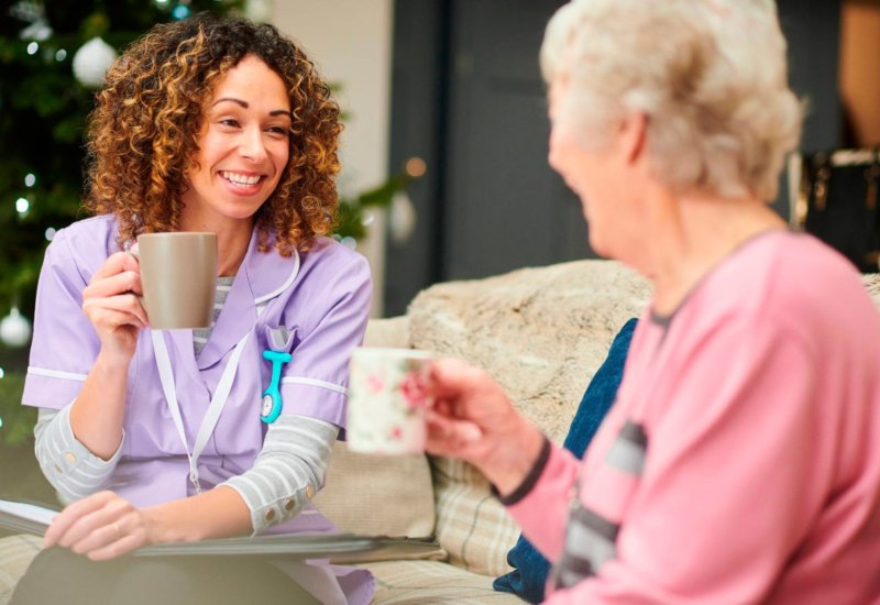 A grandmother and daughter discussing in garden